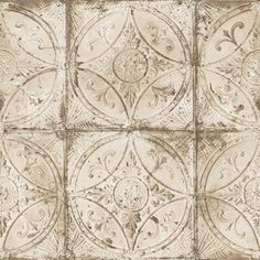 an image of a decorative tile pattern in brown and white colors on a wall or floor