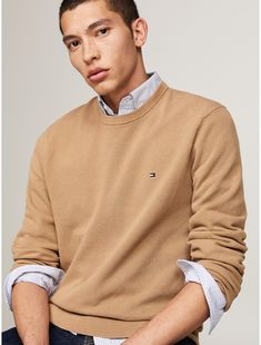 Tommy Hilfiger men's sweater. A structured knit adds refined texture to the crisp design of this pure cotton sweater.  Material: 100% Regenerative Cotton. Classic Textured Knit Sweater, Classic Knit Sweatshirt, Tommy Hilfiger Classic Crew Neck Sweater, Tommy Hilfiger Classic Winter Sweater, Tommy Hilfiger Sweater With Ribbed Cuffs For Fall, Tommy Hilfiger Fall Sweater With Ribbed Cuffs, Tommy Hilfiger Classic Fall Sweater, Classic Tommy Hilfiger Sweater For Fall, Classic Tommy Hilfiger Fall Sweater