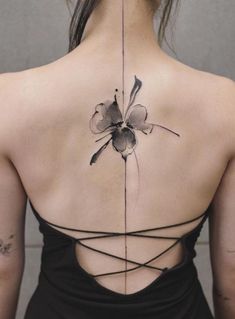 a woman with a tattoo on her back