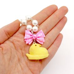 This necklace is so adorable and realistic, perfect for Easter or the entire Spring season!I handmade these super cute marshmallow chicks from polymer clay and added a realistic sugar-like texture. These charms come in your choice of a classic pastel color: white, pink, yellow, blue, or purple. Chicks are 1"x1.25". Comes on a 18" gold or silver finish necklace with glass pearls and a polka dot pink bow. Bow will be pink no matter what color chick you choose. Necklace closes with a lobster clasp. Pink Novelty Jewelry For Valentine's Day, Kawaii Pink Jewelry For Valentine's Day, Pink Kawaii Jewelry With Colorful Beads, Handmade Pink Kawaii Charm Necklaces, Handmade Pink Fairy Kei Jewelry, Cute Marshmallows, Pastel Candy, Easter Jewelry, Bow Bow