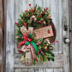 a christmas wreath hanging on the front door