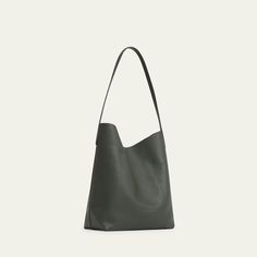 Mansur Gavriel everyday shoulder bag in calf leather  Shoulder strap, 12.5" drop Open top with magnetic closure  Interior, one slip pocket  Approx. 10.2"H x 13"W x 1.9"D Spot clean Made in Italy Modern Everyday Bucket Bag With Magnetic Closure, Everyday Smooth Grain Shoulder Bag, Leather Bucket Bag With Magnetic Closure For Daily Use, Sleek Shoulder Bag With Smooth Grain For Everyday Use, Modern Shoulder Bag With Leather Lining For Everyday Use, Modern Everyday Shoulder Bag With Leather Lining, Modern Smooth Grain Satchel Shoulder Bag, Classic Soft Leather Shoulder Bag For Daily Use, Minimalist Leather Shoulder Bag With Magnetic Closure