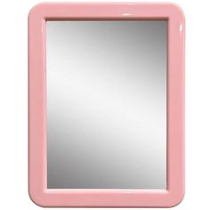 a pink mirror sitting on top of a white wall