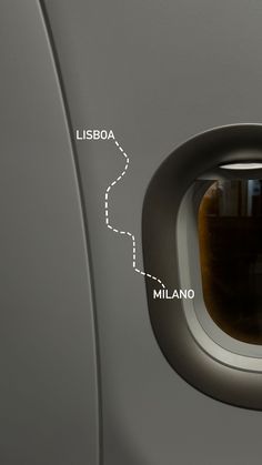 an airplane window with the view of its landing gear and location on which it is located