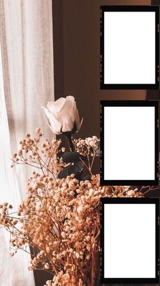 a vase filled with flowers next to two empty frames