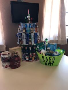 a table topped with lots of bottles and cans