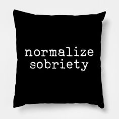 a black pillow with white lettering that says,'introverted & sarcastictic '