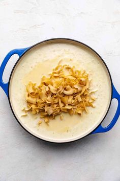 some kind of food that is in a pan on a table with white counter top