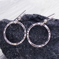 "These sparkling handcrafted sterling silver hammered circle hoop earrings will go with any outfit! Each earring is made from hand forged sterling silver wire, soldered, and hammered for texture and shine. The circles measure 3/4\" and dangles from French ear wires. Material: 925 sterling silver and French ear wires Dimensions: Circle measures 3/4\" Matching necklace can be found here https://www.etsy.com/listing/105406282/sterling-silver-eternity-karma-circle * Please read my shop policies for Hammered Open Circle Hoop Earrings For Gift, Hammered Open Circle Hoop Earrings As A Gift, Hammered Hoop Earrings As Gift, Gift Hammered Open Circle Hoop Earrings, Gift Hammered Hoop Earrings, Hammered Rings, Thumb Rings, Silver Band Ring, Hammered Silver