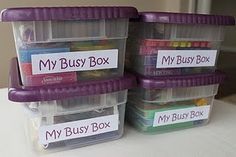 three plastic storage containers with labels on them