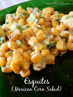 a green plate topped with corn salad on top of a table