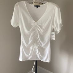 Sexy Inc Pull String Blouse In White. You Can Adjust The Front To The Amount Of Ruching You Like. V Neck Nwt. 18” Pit To Pit. 24” Long Elegant Spring Top With Ruched Sides, Trendy Ruched Stretch Blouse, Trendy Stretch Ruched Blouse, Chic Stretch Top With Drawstring, Chic Stretch Tops With Drawstring, Spring V-neck Top With Drawstring, V-neck Drawstring Top For Spring, Spring V-neck Drawstring Top, Inc International Concepts