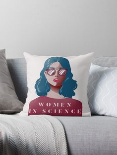 a woman in science throw pillow sitting on a couch with the words women in science