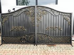 an iron gate with decorative designs on it