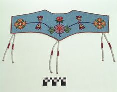 a blue headband with flowers and checkered squares on the side, hanging from strings