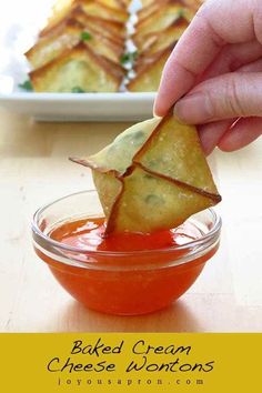 a person dipping some food into a small bowl