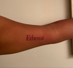 a person's arm with the word ether written on it, in red ink