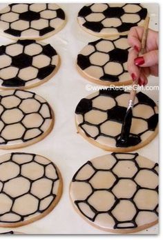 the cookies are decorated with black and white soccer balls