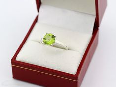 This brand new ring is made of Solid 14k White gold and authenticated with a 14k stamp. It has a dazzling high polished finish with Rhodium plating to make its shininess last longer . The natural Green peridot makes it a fine jewelry for collection. This ring is absolutely stunning and I am confident you will love it. The stone is not fully set,but will be once sold. This allows us to safely resize the ring or recast. Specs: CONDITION :Brand New. (Made to order) MATERIAL: Solid White gold with 1 Classic Peridot Solitaire Jewelry, Classic Solitaire Peridot Jewelry, Classic Round Cut Peridot Jewelry, Peridot Rings With Brilliant Cut In Fine Jewelry Style, Classic Peridot Jewelry With Brilliant Cut, Fine Jewelry Peridot Rings With Brilliant Cut, Formal Rings With Polished Peridot, Formal Peridot Rings With Polished Finish, Peridot Round Birthstone Ring For Formal Occasions