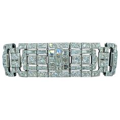 This exquisite French made 1940s Art Deco platinum and diamond bracelet consists of approximately 25 carat diamonds. It is a true work of art and a beautiful example of Art Deco jewellery. It would make a most valuable addition to any collection. Silver Art Deco Diamond Bracelet, Silver Art Deco Diamond Cut Bracelet, Art Deco Diamond Jubilee Bracelet, Art Deco Platinum Diamond Cut Bracelet, Luxury Art Deco Diamond Bracelet, Art Deco Jewellery, 1940s Art Deco, 1940s Art, Diamond Chandelier Earrings