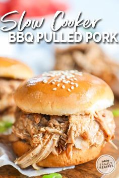 slow cooker bbq pulled pork sandwich on a cutting board with text overlay