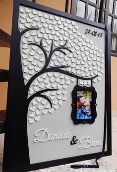 a wedding photo frame with a tree on it