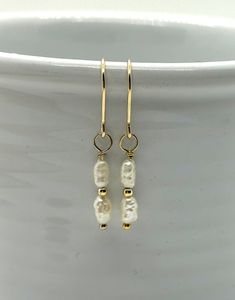 These delicate, classic earrings are made with two small fresh water pearls, paired with 2mm 14 karat gold filled beads and coupled with 14 karat gold filled wire and ear wires. They are understated with a simple elegance to them. Delicate Pearl Earrings, Water Pearls, Simple Pearl, Classic Earrings, Delicate Earrings, Simple Elegance, Freshwater Pearls, Gold Filled, Gold Earrings