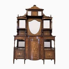 an old wooden cabinet with mirrors on it's sides and shelves in the middle