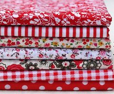 four red and white cloths stacked on top of each other in different patterns,