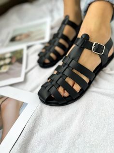 Greek Sandals for Women in black color that are made from 100% genuine leather. You can also find them in brown color in my store. Read the description below. Find them only at Christina Christi Store. MATERIALS - 100% Greek Leather in Black color - 100% Handmade Sandals. - The sole is lightweight and handmade with of high-durability rubber. You can enjoy miles of safety walk and sandal's soles will be always on shape. - Each pair of this leather sandals is unique. Sometimes has some small natur Black T-strap Sandals With Leather Footbed And Open Heel, Casual Black Sandals With Leather Strap, Black Closed Toe Leather T-strap Sandals, Leather Jelly Sandals With Round Toe For Vacation, Black Leather Strap Open Toe Sandals, Black Sandals With Leather Strap And Round Toe, Black Flat Jelly Sandals With Buckle Closure, Black Adjustable T-strap Sandals With Leather Footbed, Black Closed Toe T-strap Sandals For Vacation