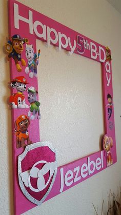 a pink frame decorated with cartoon characters and the words happy 5th birthday jezebel