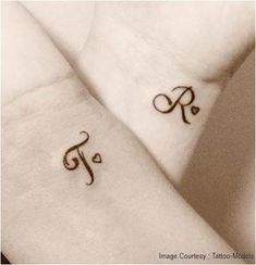 two people with matching tattoos on their wrist