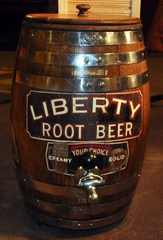 a wooden barrel sitting on top of a carpeted floor