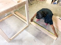 a man working on some kind of wooden structure