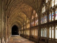 the inside of a cathedral with stained glass windows