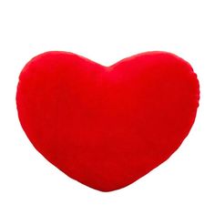 a red heart shaped pillow on a white background