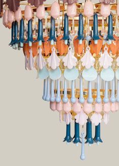 a chandelier with many different colored umbrellas hanging from it's sides