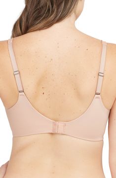 Smooth, seamless coverage defines an underwire bra that minimizes your bustline up to one inch, with wide side slings for added support. Built-in side-sling support 82% nylon, 18% elastane Machine wash, dry flat Imported Casual Stretch Bra With Built-in Support, Spring Low-cut Bra With Removable Pads, Spring Cream Bra With Built-in Support, Beige Seamless Underwire Bra, Nylon Underwire Sports Bra With Built-in Bra, Minimiser Bra, One Inch, Low Profile, Underwire Bra