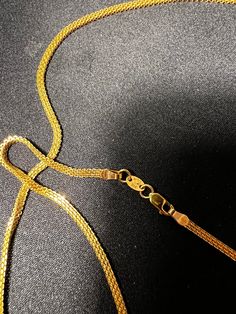 Embrace the allure of pure sophistication with our exquisite 22k gold chain, a versatile piece that transcends the ordinary. Designed for both him and her, this 22-inch masterpiece radiates with a warm glow, adding an understated luxury to any ensemble. Why Choose Our 22K Gold Chain? This chain isn't just an accessory; it's an investment. With its timeless appeal and solid gold composition, it promises to be a staple in your jewelry collection, withstanding the test of time and trends. 22k Gold Chain Necklace For Wedding, Luxury 22k Gold Chain Necklace Gift, Elegant 22k Gold Jewelry With Box Chain, Gold Snake Chain Necklace For Wedding, Elegant 22k Gold Chain Jewelry, 22k Yellow Gold Chain Necklace For Wedding, 14k Gold Wedding Chain Necklace, Elegant 22k Gold Link Necklaces, Gold 22k Box Chain Necklace