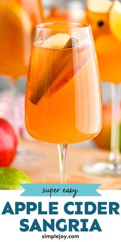 an apple cider sangria is garnished with sliced apples