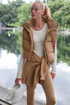 What to Wear to a Football Game: 9 Outfit Ideas | Who What Wear Nfl Family, Collar Work, A Football, Gold Rush, Back Women, Football Game, Alo Yoga, Puffer Vest, Cinched Waist