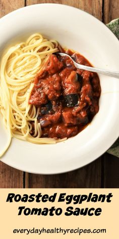 a white bowl filled with spaghetti and tomato sauce