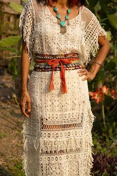 "Handmade Bohemian Lace Maxi Dress. Stretchable lace Fabric. Color cream, Off white, Black Measurements, Bust: 44 inches stretch up to 56 inches Around Hip: 42\" stretch up to 56\" Around. Length: With Fringe 55 inches. NOTE: If you want to open the side seams to have knee high slits above the knee please let me know. Care: Hand wash cold. Lay flat to dry. Do not hang after dry. ( its will get longer)" Bohemian Short Sleeve Dress With Lace Patchwork, Bohemian Short Sleeve Lace Patchwork Dresses, Traditional Beige Lace Dress, Beige Crochet Lace Dress For Festival, Bohemian Lace Dress With Short Sleeves, Summer Lace Dresses With Fringe, Bohemian Lace Dress With Patchwork, Cream Bohemian Dress With Lace Patchwork, Bohemian Lace Dress With Lace Trim