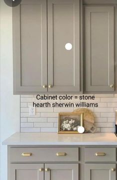 a kitchen with gray cabinets and white tile backsplashes, including the words cabinet color = stone heartth shewn williams