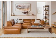 a living room filled with furniture and a wooden coffee table