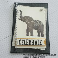 a close up of a card with an elephant on it's side and the words celebrate