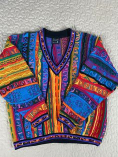 Up for sale is a Coogi Australia Wool V Neck Sweater Mens sz L Vintage Colorful cosby biggie. Condition is "Pre-owned" in excellent condition. Beautiful colorway. Shipped with USPS Priority Mail. Please review all photos and ask questions before purchasing. Thanks 1980's Sweaters, Coogi Sweater Men Outfit, Coogi Sweater, Style Moodboard, Retro Sweater, Vintage Sweaters, V Neck Sweater, Textile Design, Vneck Sweater