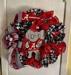 a red and black wreath with an elephant on it