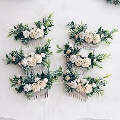 three combs with flowers and greenery are arranged on a white tablecloth background