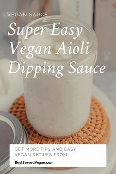 a jar filled with vegan aioli dipping sauce on top of a plate